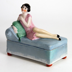 Art Deco Porcelain Dressing Table Box of a Lady Reclining on a Blue Daybed