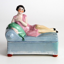Art Deco Porcelain Dressing Table Box of a Lady Reclining on a Blue Daybed