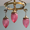 Arts and Crafts Brass Electrolier with Three Drop Cranberry Tinted Shades