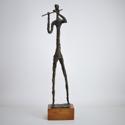 A Giacometti Style Bronze Figure of a Musician (c.1970)