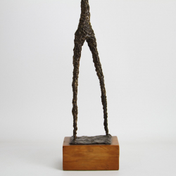 A Giacometti Style Bronze Figure of a Musician
