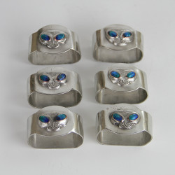 Archibald Knox for Liberty & Co Set of Six Pewter and Enamel Napkin Rings (c.1906)