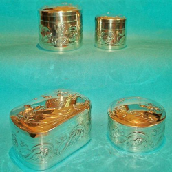 Set of Four WMF Silver Plated Dressing Table Boxes Decorated with Flowers Reeds and Fish