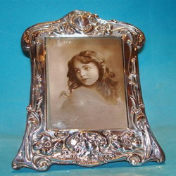 Art Nouveau Silver Photograph Frame Decorated with Foliage & Flowing Female Profile